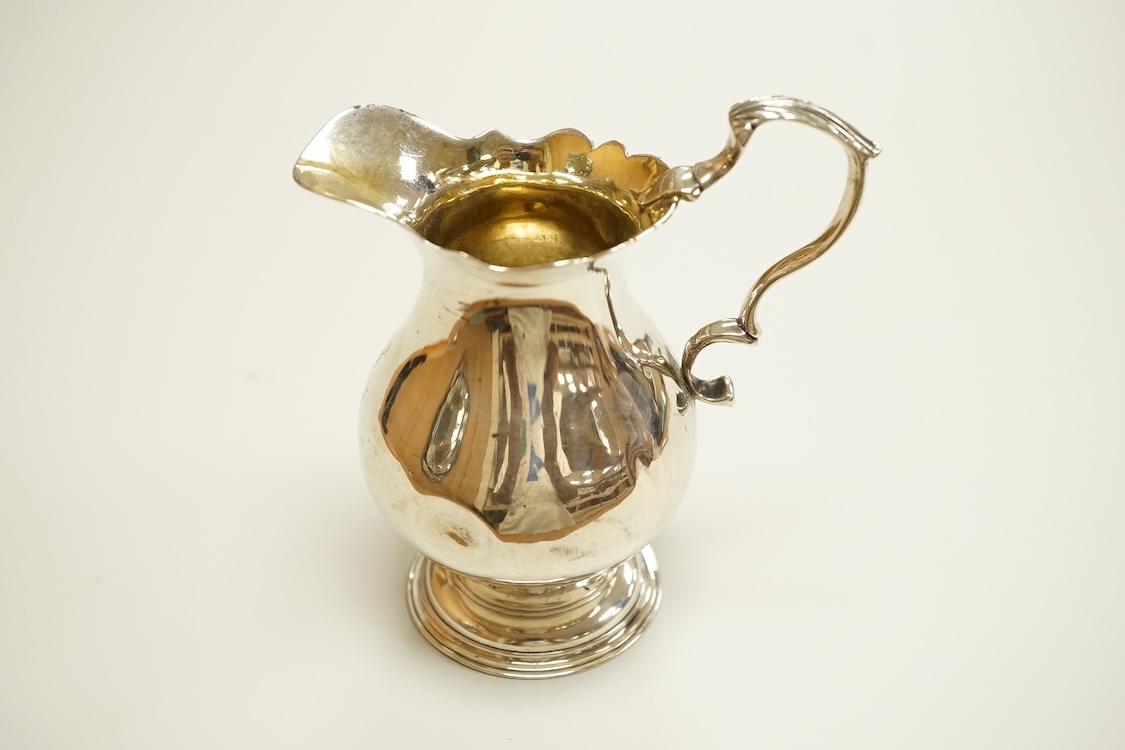 A George II silver baluster cream jug, George Greenhill Jones, London, 1743, height 96mm, 80 grams.